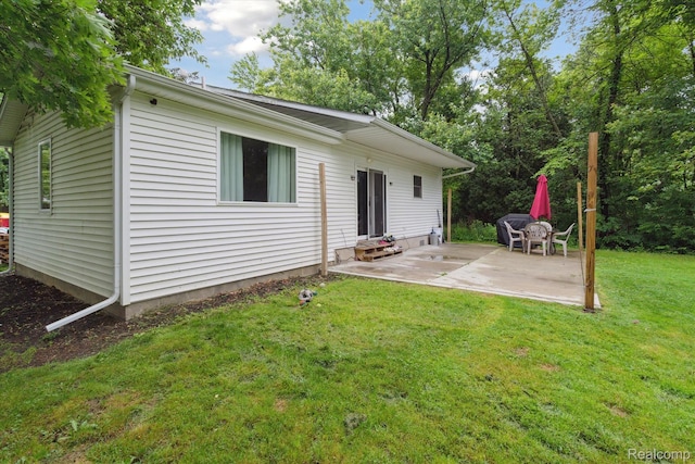 759 Elm St, Allenton, MI 48002 - back of house with a patio area, a yard, and entry steps