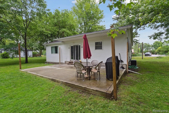 759 Elm St, Allenton, MI 48002 - back of house with a patio and a lawn