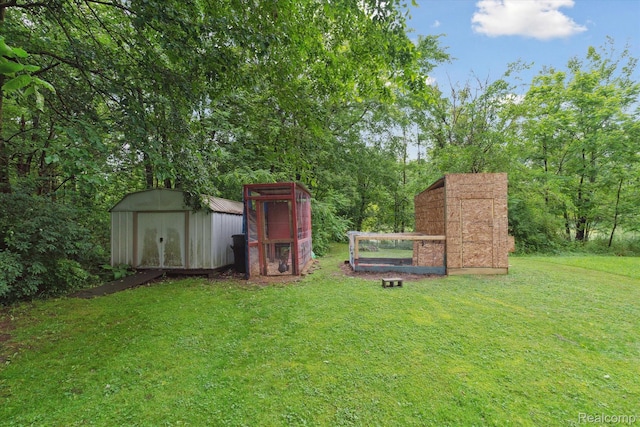 759 Elm St, Allenton, MI 48002 - view of grassy yard with a shed