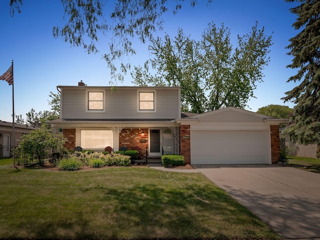 3640 Pall Dr, Warren, MI 48092 - traditional-style house with a garage, a front yard, brick siding, and concrete driveway