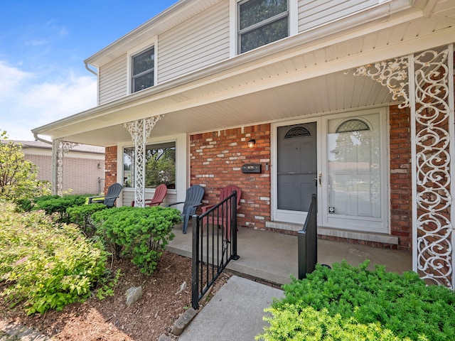 3640 Pall Dr, Warren, MI 48092 - view of exterior entry with a porch and brick siding