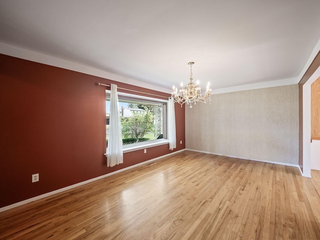 3640 Pall Dr, Warren, MI 48092 - empty room with a chandelier, wood finished floors, and crown molding