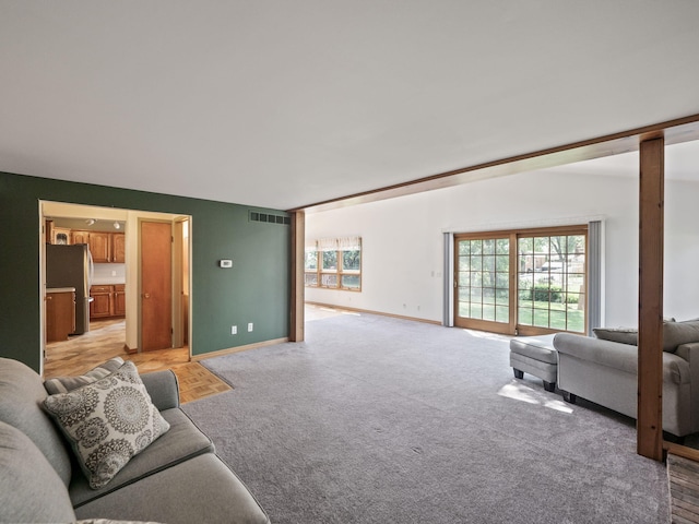 3640 Pall Dr, Warren, MI 48092 - living area with healthy amount of natural light and light colored carpet