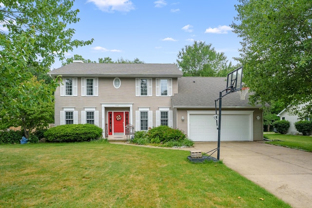 220 Deer Path Ln, Battle Creek, MI 49015 - colonial inspired home featuring a front yard, driveway, and an attached garage