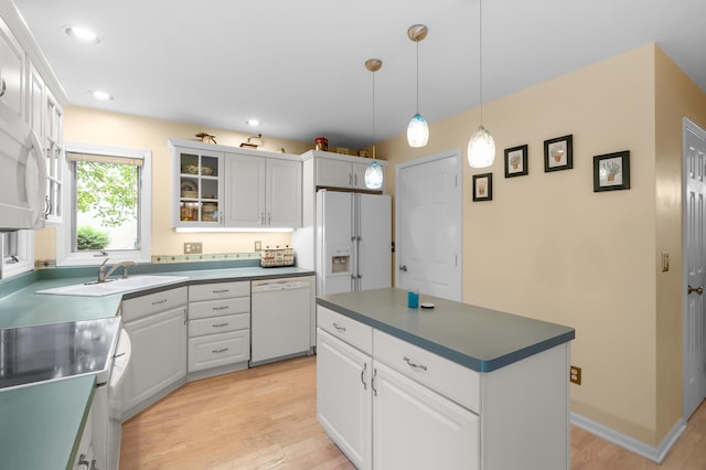 220 Deer Path Ln, Battle Creek, MI 49015 - kitchen featuring white appliances, light wood-style floors, glass insert cabinets, white cabinetry, and recessed lighting