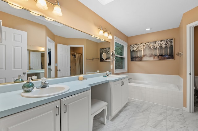 220 Deer Path Ln, Battle Creek, MI 49015 - full bathroom with double vanity, a garden tub, and marble look tile flooring