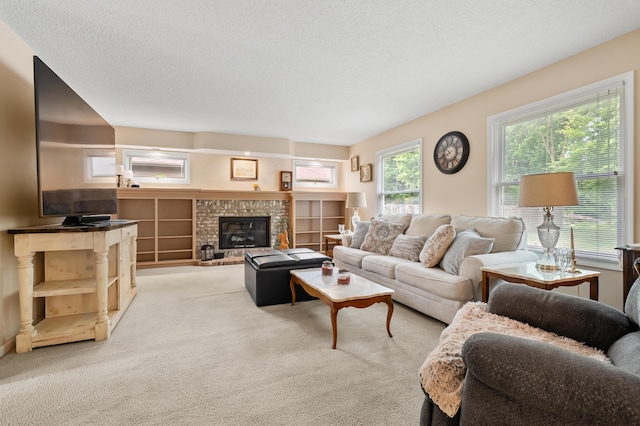 220 Deer Path Ln, Battle Creek, MI 49015 - living room featuring carpet flooring, a fireplace, and a textured ceiling