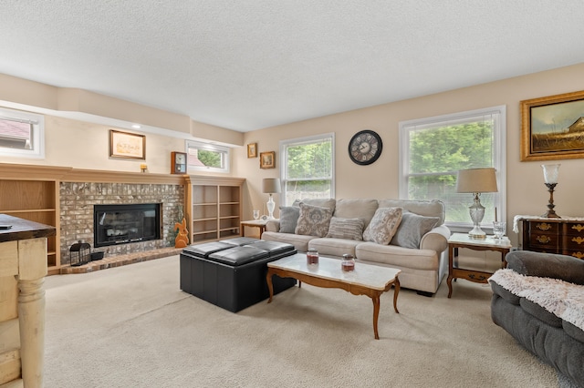 220 Deer Path Ln, Battle Creek, MI 49015 - living room featuring carpet floors, a textured ceiling, and a brick fireplace