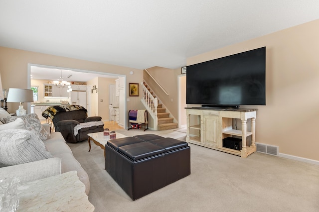 220 Deer Path Ln, Battle Creek, MI 49015 - living area with a chandelier, stairs, and light carpet