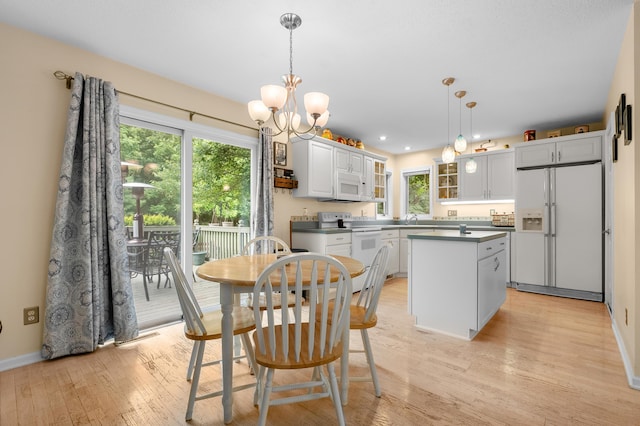 220 Deer Path Ln, Battle Creek, MI 49015 - dining space featuring a chandelier, light wood finished floors, plenty of natural light, and recessed lighting