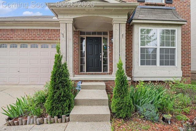 27455 Harrington Way, Novi, MI 48374 - view of exterior entry featuring brick siding, an attached garage, and concrete driveway