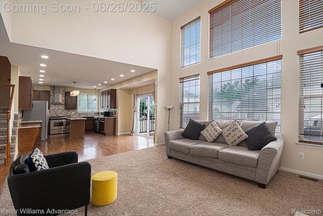 27455 Harrington Way, Novi, MI 48374 - living room with recessed lighting, wood finished floors, and a towering ceiling