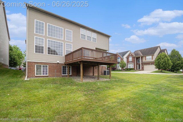 27455 Harrington Way, Novi, MI 48374 - back of house with a wooden deck, a lawn, and brick siding