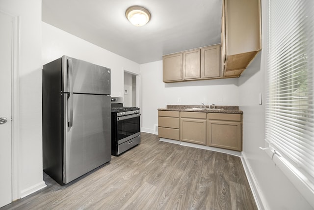 470 Fildew Ave, Pontiac, MI 48341 - kitchen with appliances with stainless steel finishes and light wood-style flooring