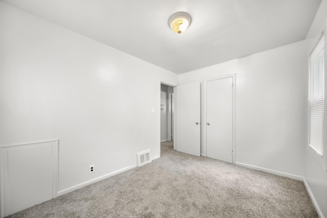 470 Fildew Ave, Pontiac, MI 48341 - unfurnished bedroom with carpet, multiple windows, and a closet