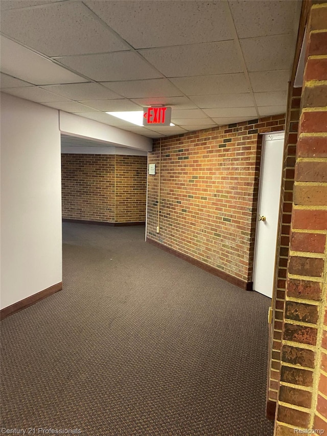 29900 N Grand Oaks Dr Unit 26, Warren, MI 48092 - finished below grade area with brick wall, carpet, and a paneled ceiling