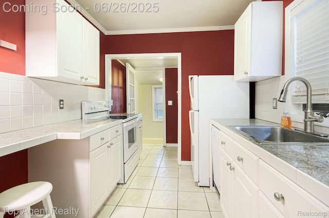 525 Marlin Ave, Royal Oak, MI 48067 - kitchen with white range with electric cooktop, tasteful backsplash, light tile patterned floors, white cabinetry, and ornamental molding