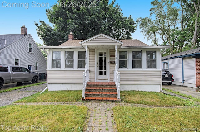 525 Marlin Ave, Royal Oak, MI 48067 - view of front of house with a front yard and a shingled roof