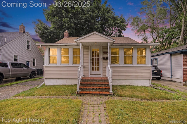 525 Marlin Ave, Royal Oak, MI 48067 - bungalow-style home featuring a front yard, roof with shingles, and a chimney