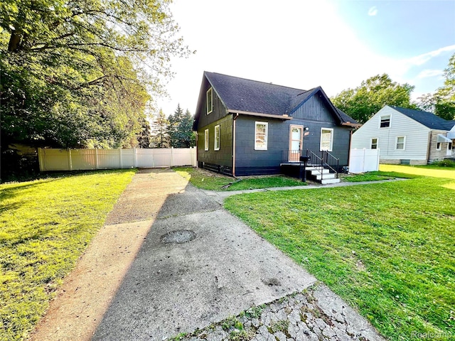 23657 Hill Ave, Warren, MI 48091 - rear view of house with a shingled roof