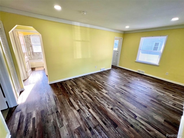 23657 Hill Ave, Warren, MI 48091 - unfurnished room with ornamental molding, arched walkways, dark wood-type flooring, a smoke detector, and recessed lighting