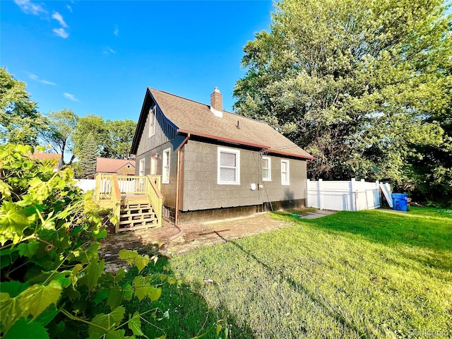 23657 Hill Ave, Warren, MI 48091 - back of house with a chimney, a deck, roof with shingles, and stairway