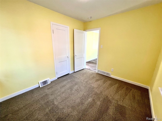 23657 Hill Ave, Warren, MI 48091 - unfurnished room with dark carpet and baseboards