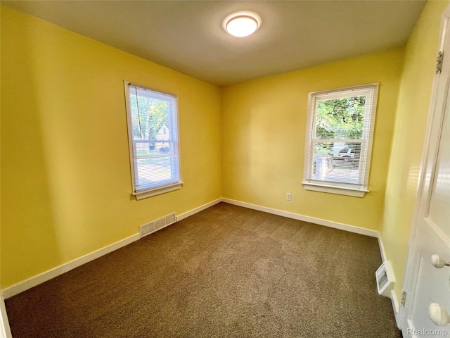 23657 Hill Ave, Warren, MI 48091 - unfurnished room with dark colored carpet and baseboards