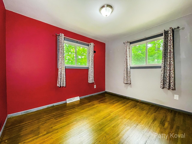 4164 Madison Ave SE, Grand Rapids, MI 49548 - spare room with plenty of natural light and wood finished floors