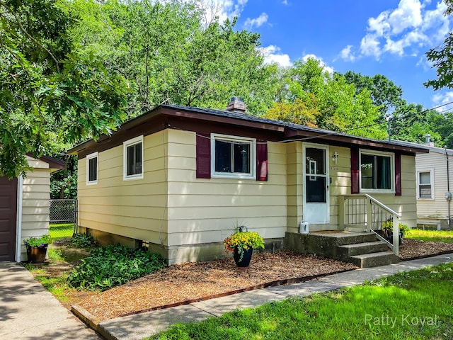 4164 Madison Ave SE, Grand Rapids, MI 49548 - view of front of house with a chimney