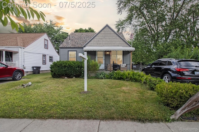 8025 Mayfair St, Taylor, MI 48180 - view of front facade with a front lawn and roof with shingles