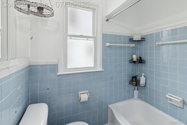 8025 Mayfair St, Taylor, MI 48180 - bathroom with a bath, tile walls, and a wainscoted wall