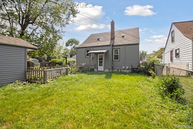 8025 Mayfair St, Taylor, MI 48180 - back of house featuring a chimney and roof with shingles