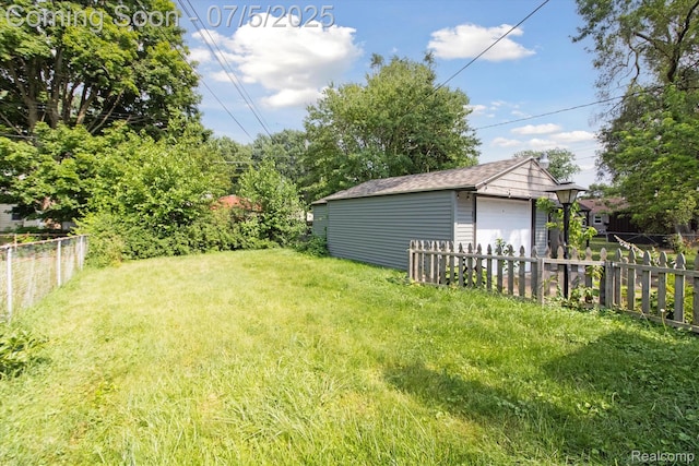 8025 Mayfair St, Taylor, MI 48180 - view of yard featuring a garage and an outbuilding