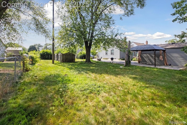 8025 Mayfair St, Taylor, MI 48180 - view of yard with a gazebo and a patio area