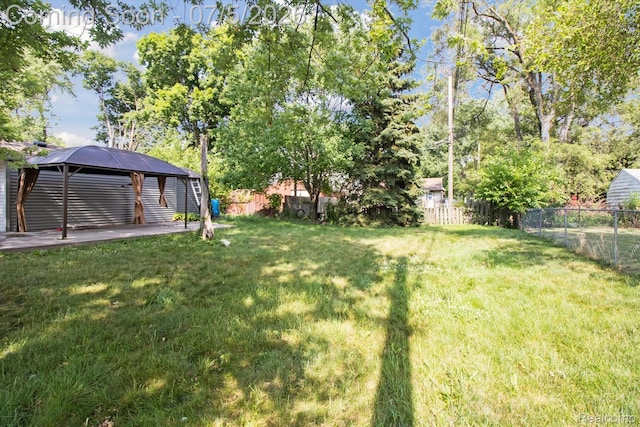 8025 Mayfair St, Taylor, MI 48180 - fenced backyard featuring a gazebo and a patio