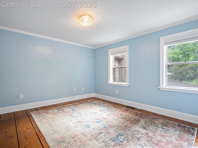 9767 Whisperwood Ln, Brighton, MI 48116 - unfurnished room with crown molding and hardwood / wood-style floors