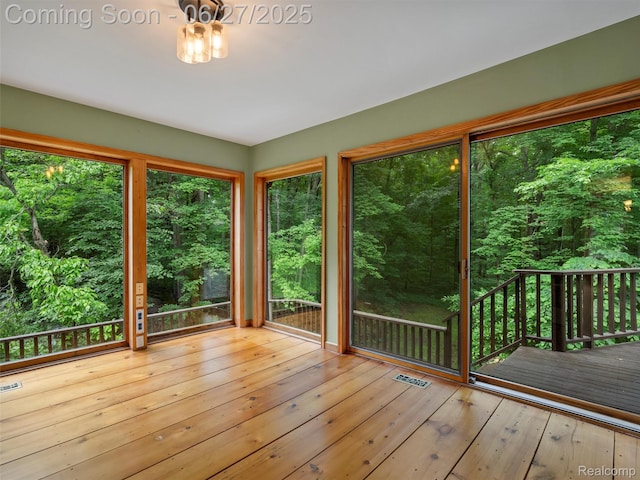 9767 Whisperwood Ln, Brighton, MI 48116 - unfurnished sunroom featuring a deck and hardwood / wood-style floors
