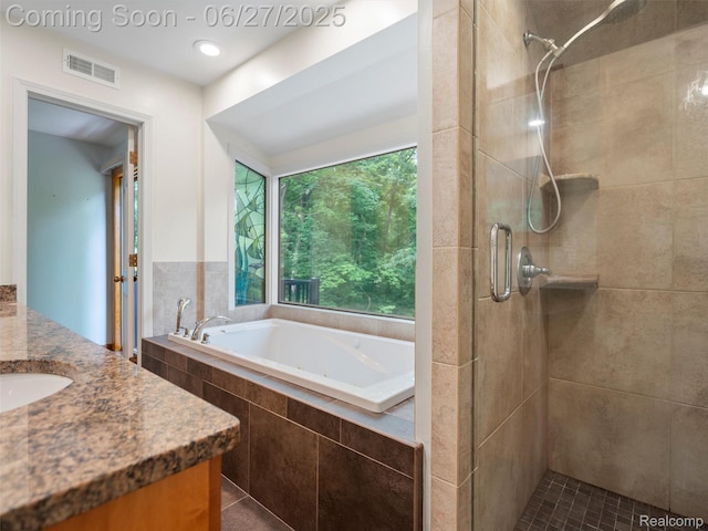 9767 Whisperwood Ln, Brighton, MI 48116 - full bath featuring vanity, a stall shower, and a garden tub