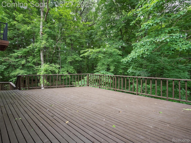 9767 Whisperwood Ln, Brighton, MI 48116 - wooden deck featuring a wooded view