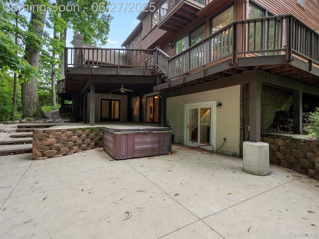 9767 Whisperwood Ln, Brighton, MI 48116 - back of house with a hot tub, a patio area, ceiling fan, and a deck