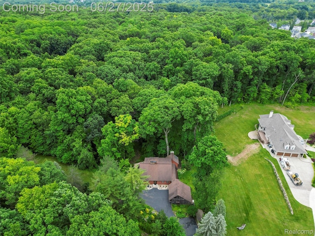 9767 Whisperwood Ln, Brighton, MI 48116 - aerial view of property's location featuring a forest