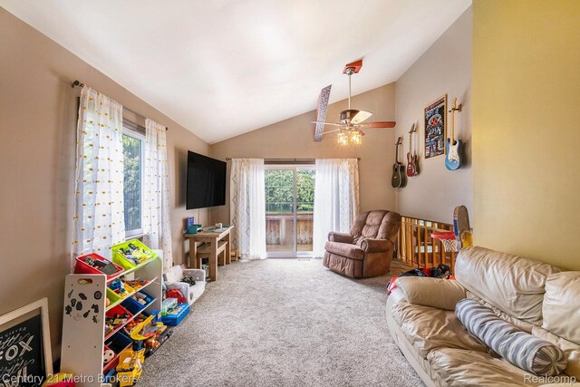 6428 W Court St, Flint, MI 48532 - living area featuring carpet, vaulted ceiling, and a ceiling fan