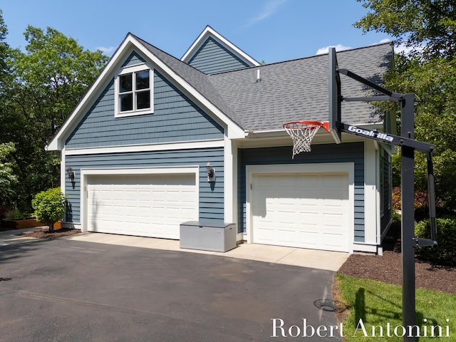 1977 Emerald Glen Ct NE, Ada, MI 49301 - view of front of house with roof with shingles and driveway