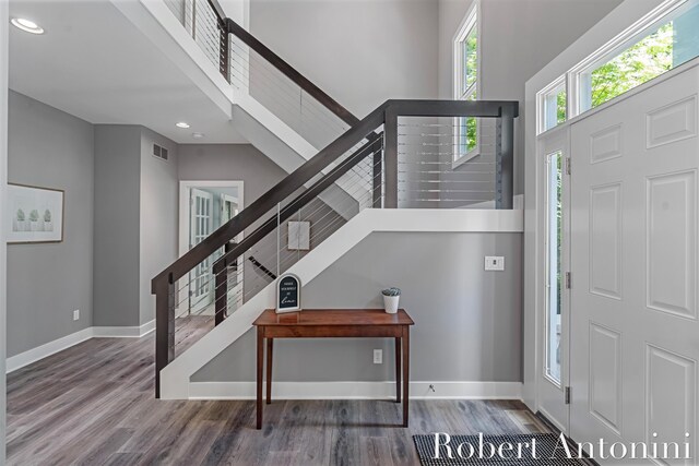 1977 Emerald Glen Ct NE, Ada, MI 49301 - entrance foyer with stairway, wood finished floors, recessed lighting, and a high ceiling