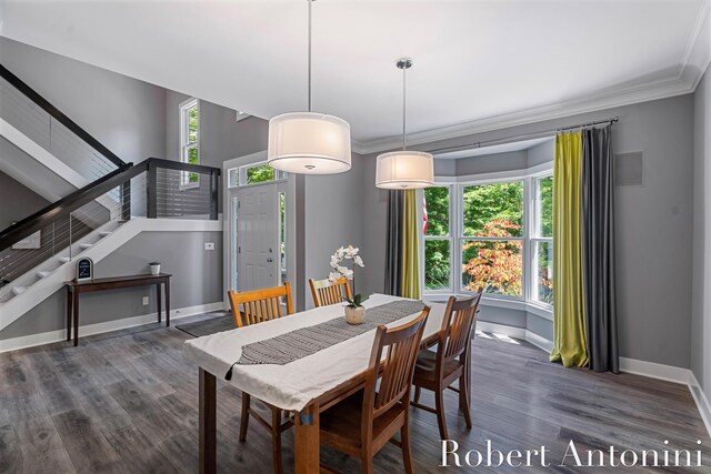 1977 Emerald Glen Ct NE, Ada, MI 49301 - dining area with stairway, ornamental molding, and wood finished floors