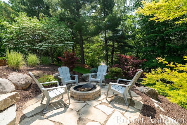 1977 Emerald Glen Ct NE, Ada, MI 49301 - view of patio featuring an outdoor fire pit