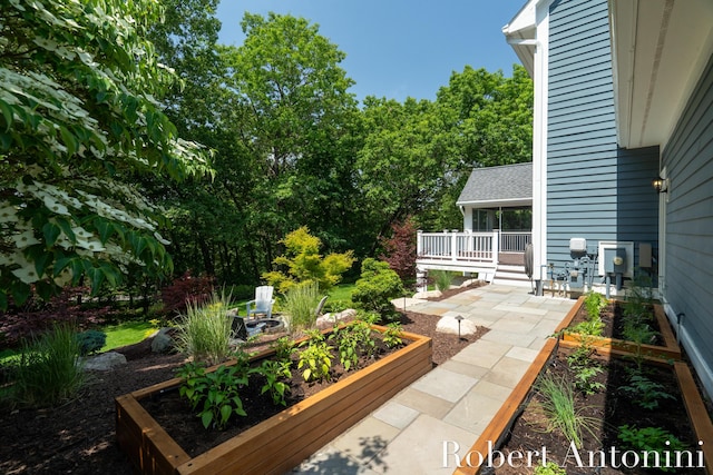 1977 Emerald Glen Ct NE, Ada, MI 49301 - view of yard featuring a vegetable garden and a patio area
