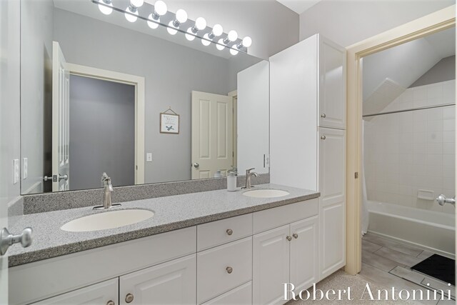 1977 Emerald Glen Ct NE, Ada, MI 49301 - full bath featuring double vanity and shower / tub combo with curtain