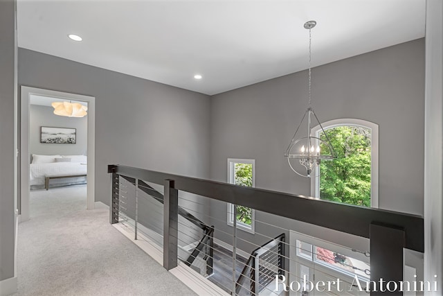 1977 Emerald Glen Ct NE, Ada, MI 49301 - corridor with an upstairs landing, a chandelier, carpet, and recessed lighting